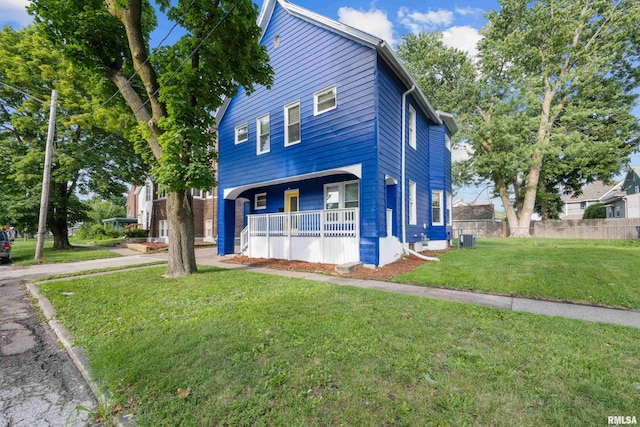 view of front property featuring a porch and a front lawn