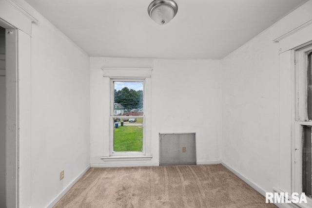 carpeted empty room featuring a healthy amount of sunlight