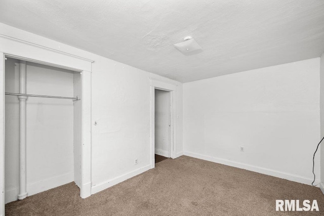 unfurnished bedroom featuring a closet and carpet floors