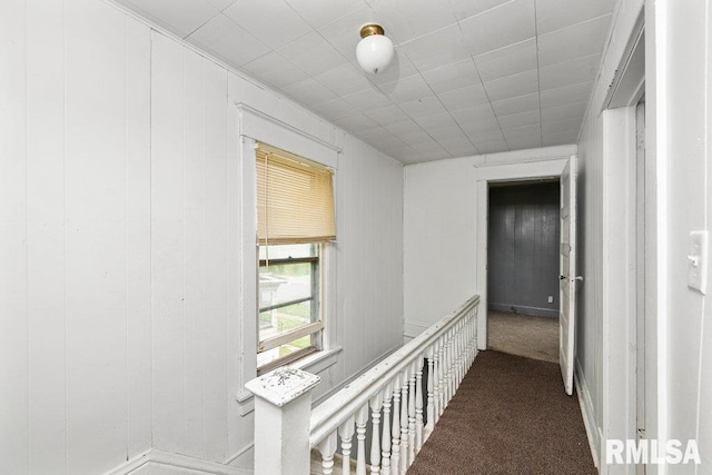 corridor with carpet flooring