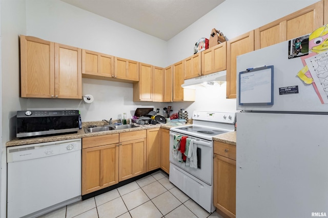 kitchen with sink, white appliances, light tile patterned flooring, and light brown cabinets