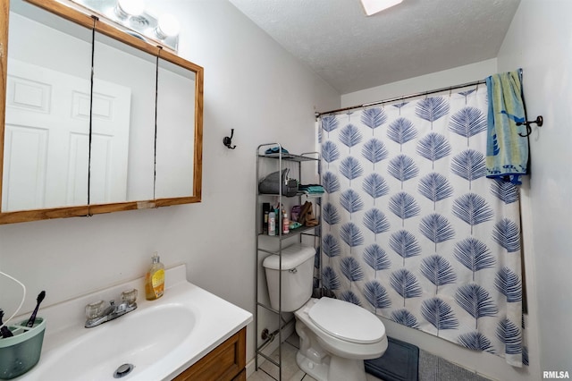 bathroom with vanity, walk in shower, a textured ceiling, and toilet