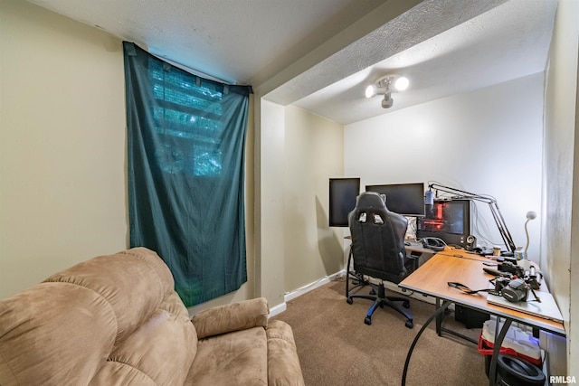 office featuring carpet floors and a textured ceiling