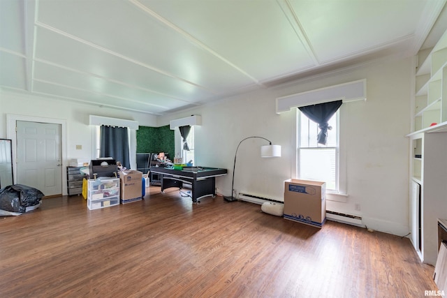 miscellaneous room featuring wood-type flooring and a baseboard radiator