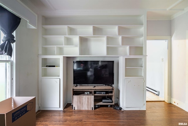 unfurnished living room with hardwood / wood-style floors, crown molding, built in shelves, and baseboard heating