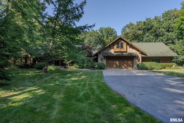 view of front of house with a garage and a front yard