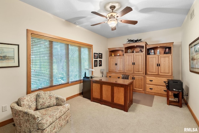 office space with light colored carpet and ceiling fan