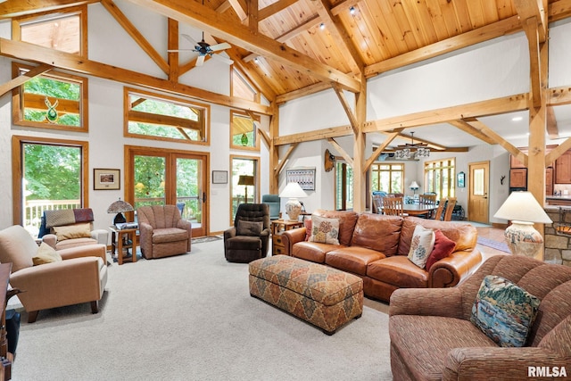 carpeted living room with french doors, wood ceiling, ceiling fan, beamed ceiling, and high vaulted ceiling