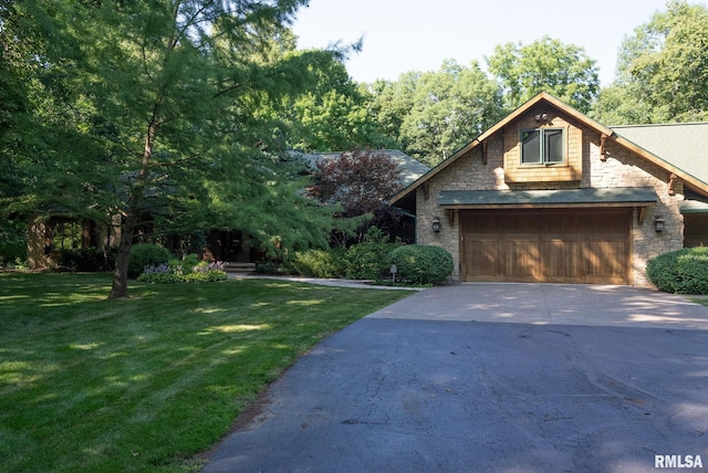 view of front of property featuring a garage and a front yard