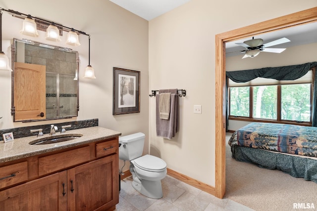 bathroom with vanity, tile patterned flooring, ceiling fan, and toilet