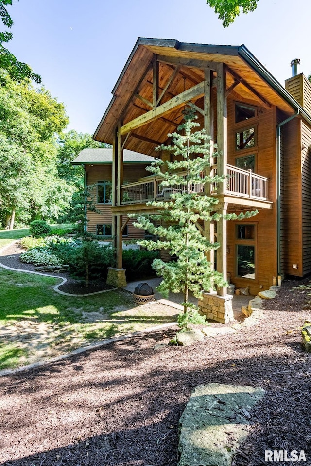 view of home's exterior with a balcony