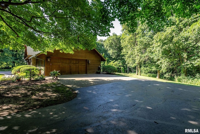 view of property exterior featuring a garage