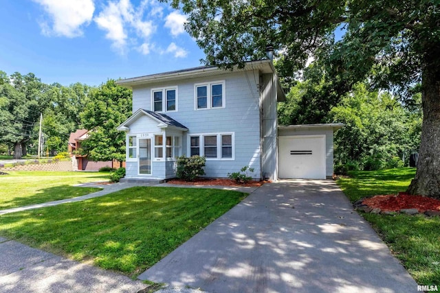 view of front of property with a garage and a front yard