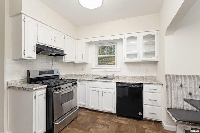 kitchen with stainless steel gas range oven, white cabinetry, tasteful backsplash, black dishwasher, and sink