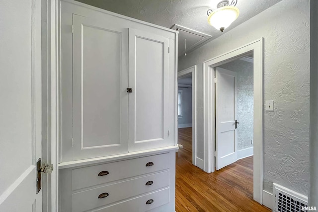 hallway with light hardwood / wood-style floors