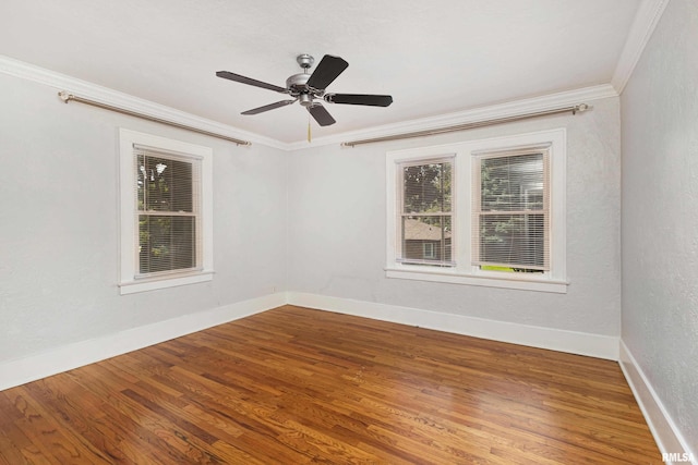 spare room featuring ornamental molding, ceiling fan, and hardwood / wood-style floors