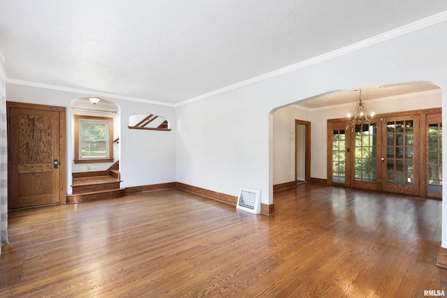 unfurnished room featuring crown molding and hardwood / wood-style flooring