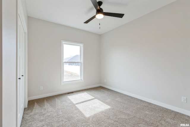4613 W 12th St, Davenport, IA 52804 - unfurnished bedroom featuring carpet flooring, baseboards, and a ceiling fan