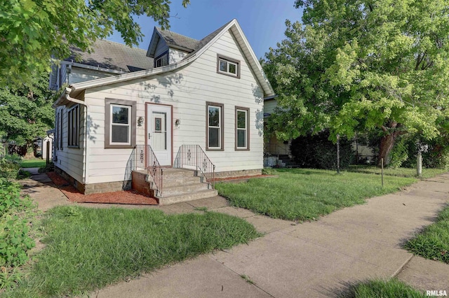 view of front of property with a front lawn