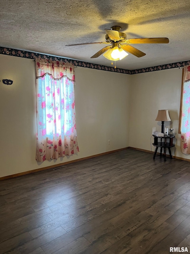 spare room with a textured ceiling, hardwood / wood-style floors, and ceiling fan