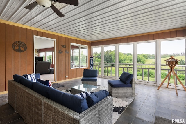 sunroom with a ceiling fan