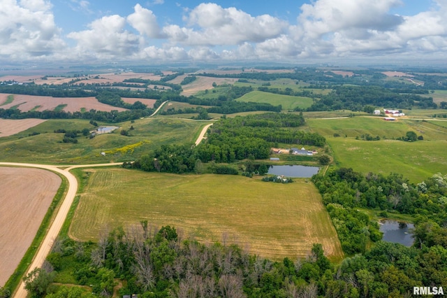 drone / aerial view with a water view and a rural view