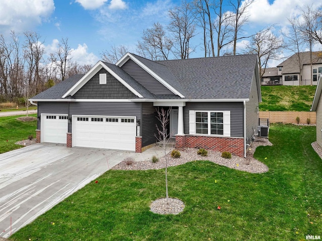 craftsman-style house with a garage and a front lawn