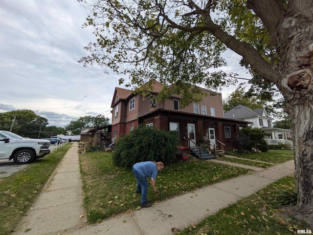 view of property exterior featuring a lawn