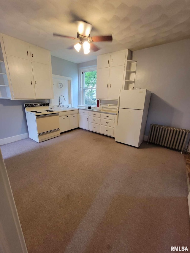 kitchen with white cabinetry, sink, light colored carpet, white appliances, and ceiling fan