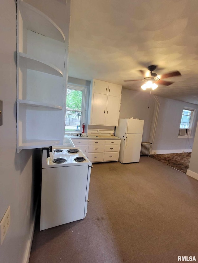 kitchen featuring ceiling fan, light carpet, white cabinetry, and white appliances