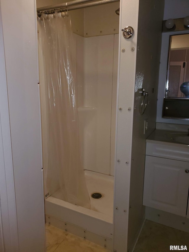 bathroom featuring vanity and walk in shower