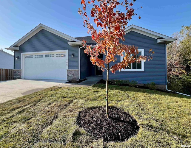 view of front of house featuring a garage and a front yard