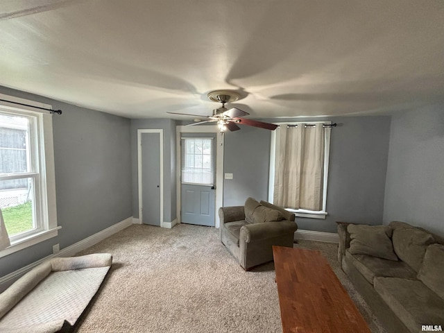 living room featuring ceiling fan and light carpet