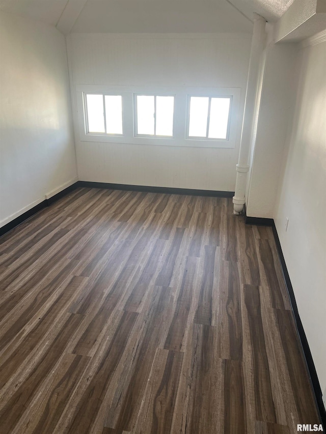 unfurnished room featuring dark hardwood / wood-style floors