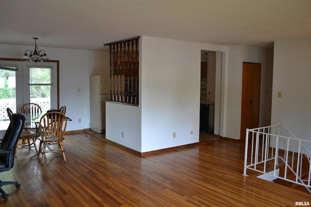 interior space featuring an inviting chandelier and dark hardwood / wood-style floors