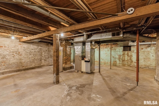 basement featuring heating unit and gas water heater