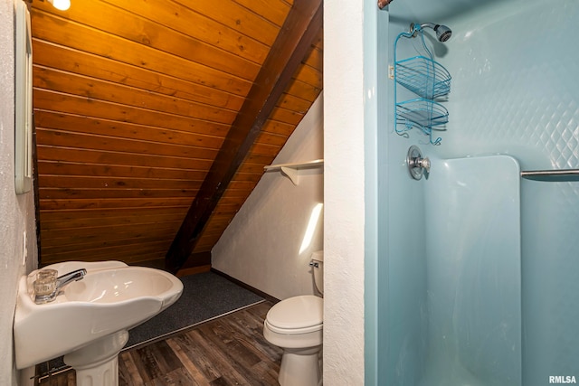 bathroom with vaulted ceiling with beams, wooden ceiling, a shower, and hardwood / wood-style floors