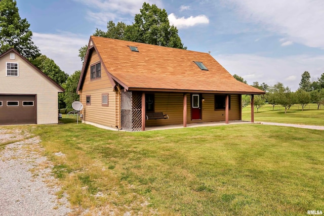 view of front of house with a garage and a front yard