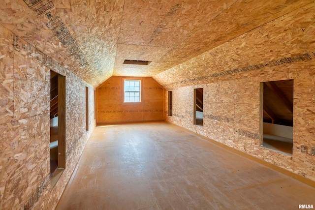 bonus room featuring lofted ceiling