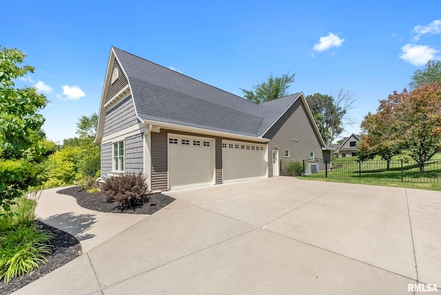 view of side of home featuring a garage