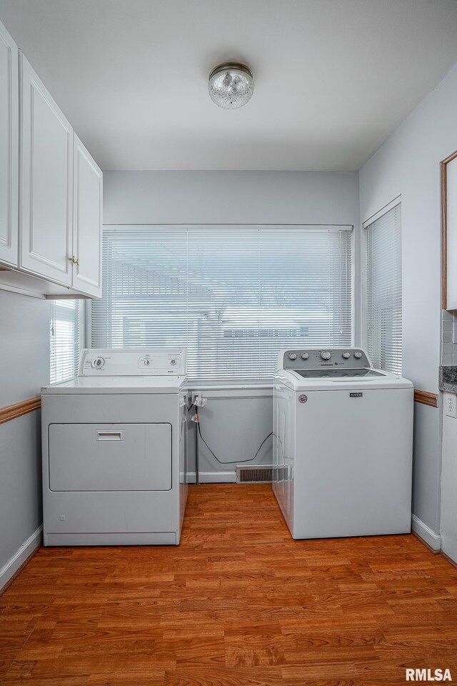 kitchen featuring stainless steel dishwasher, dark hardwood / wood-style flooring, backsplash, and sink