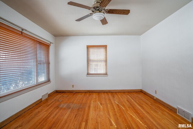 empty room featuring ceiling fan and dark hardwood / wood-style floors