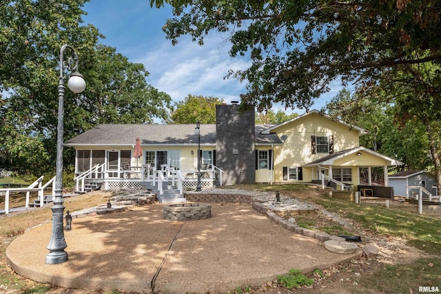 rear view of house with a sunroom