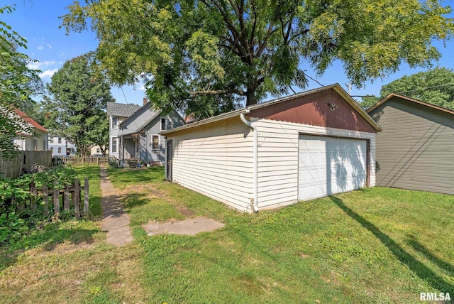 exterior space with a yard and a garage