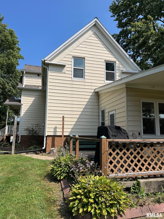 view of home's exterior with a yard