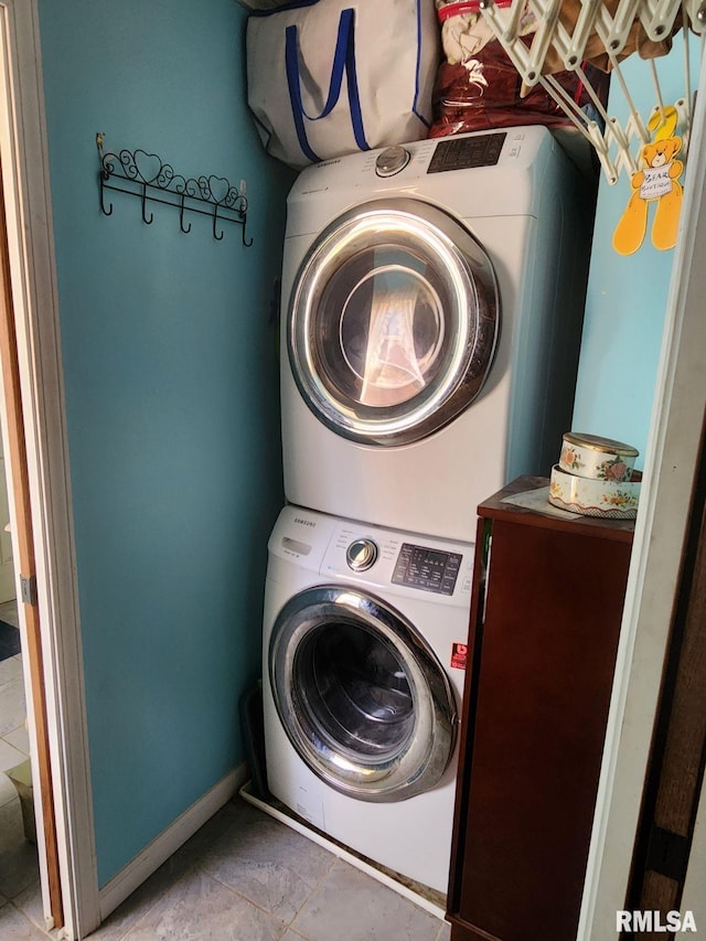 washroom with stacked washer and dryer