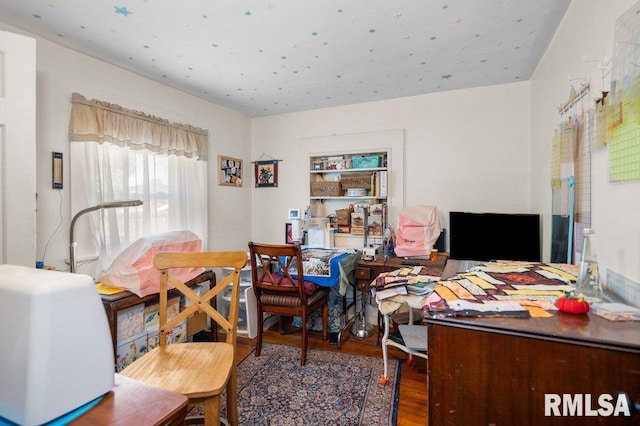 home office with hardwood / wood-style floors