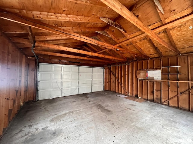 garage featuring wooden walls