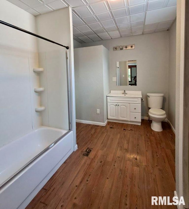 full bathroom featuring vanity, toilet, wood-type flooring, and shower / bathtub combination