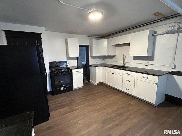 kitchen featuring black appliances, sink, white cabinetry, and dark wood-type flooring